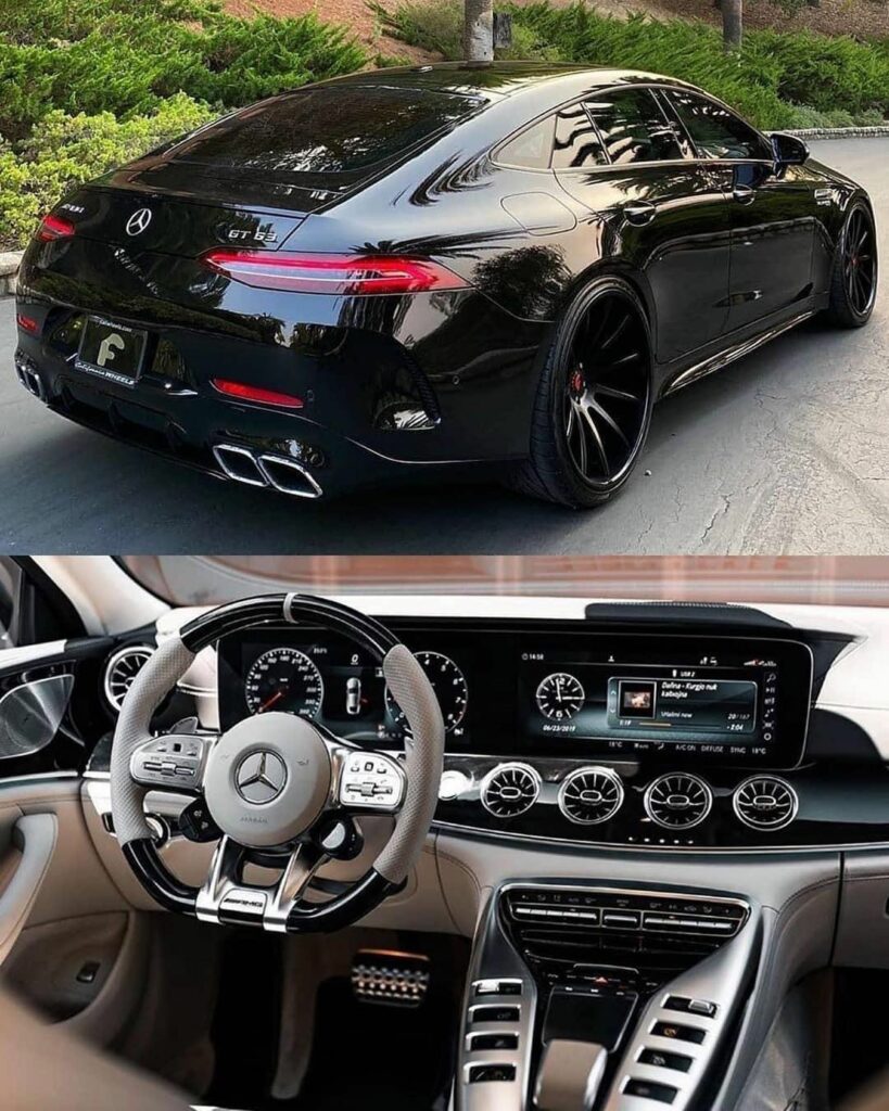 a black car with a steering wheel and dashboard
